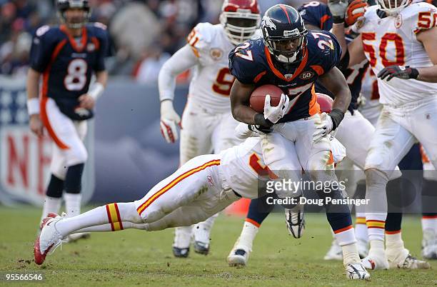 Running back Knowshon Moreno of the Denver Broncos rushes for yardage as Travis Daniels of the Kansas City Chiefs makes the tackle during NFL action...