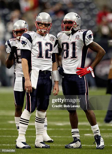 Quarterback Tom Brady and wide receiver Randy Moss talk during warm ups before playing the Houston Texans at Reliant Stadium on January 3, 2010 in...