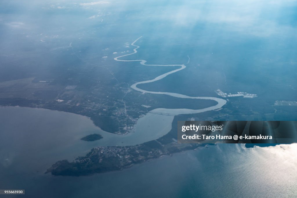 Sedili Besar in Johor in Malaysia sunset time aerial view from airplane