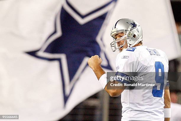 Quarterback Tony Romo of the Dallas Cowboys celebrates a touchdown by Felix Jones against the Philadelphia Eagles at Cowboys Stadium on January 3,...