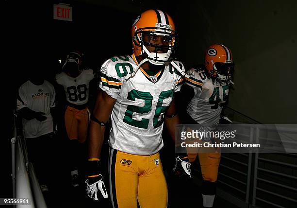 Cornerback Josh Bell of the Green Bay Packers runs out to the field before taking on the Arizona Cardinals during the NFL game at the Universtity of...