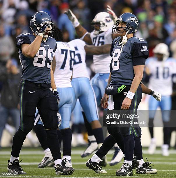 Quarterback Matt Hasselbeck and tight end John Carlson of the Seattle Seahawks walk off the field after failing to convert on 4th down late in the...