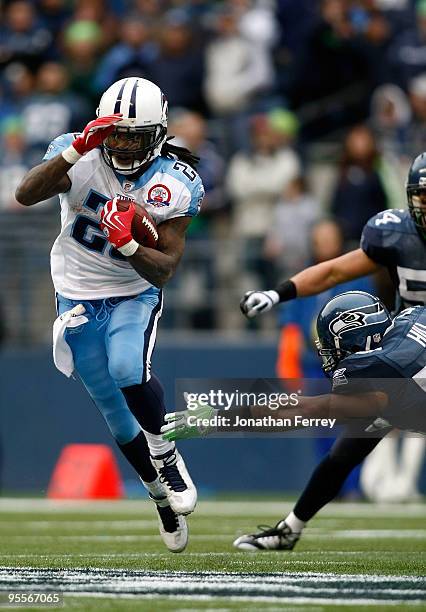 Chris Johnson of the Tennessee Titans runs with the ball against the Seattle Seahawks 17-13 at Qwest Field on January 3, 2010 in Seattle, Washington....