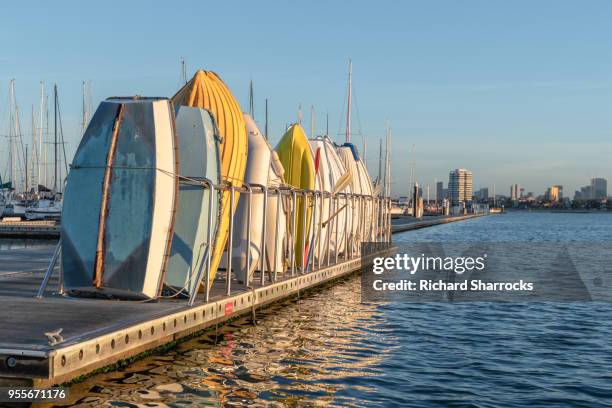 stacked tender rowing boats at st kilda marina, melbourne, australia - st kilda stock pictures, royalty-free photos & images