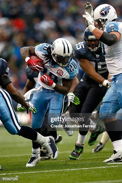 Chris Johnson of the Tennessee Titans runs with the ball against the Seattle Seahawks 17-13 at Qwest Field on January 3, 2010 in Seattle, Washington....