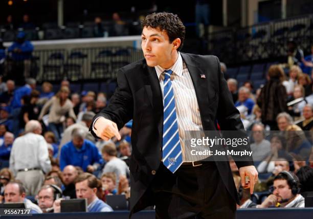 Josh Pastner, head coach of the Memphis Tigers points against the Houston Baptist Huskies on January 3, 2010 at FedExForum in Memphis, Tennessee. The...