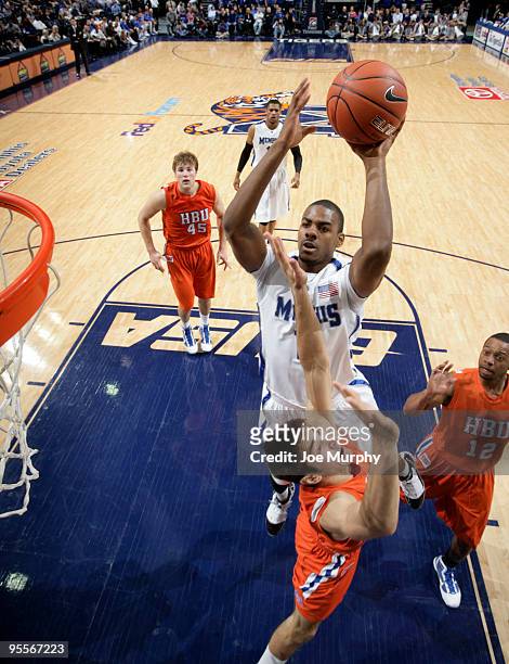 Elliot Williams of the Memphis Tigers shoots over Andrew Gonzalez of the Houston Baptist Huskies on January 3, 2010 at FedExForum in Memphis,...