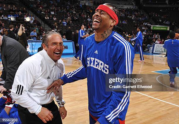 Assistant coach/strength and conditioning coach Steve Hess of the Denver Nuggets laughs with Allen Iverson of the Philadelphia 76ers prior to the...