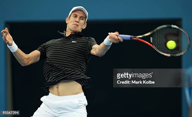 Jarkko Nieminen of Finland plays a forehand in his first round match against Richard Gasquet of France during day two of the Brisbane International...