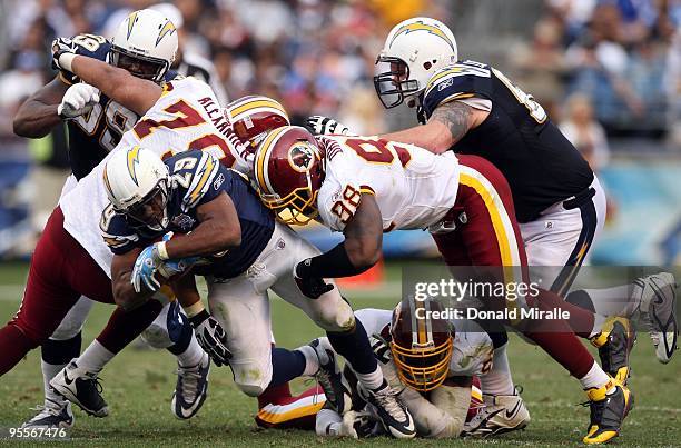 Runningback Michael Tolbert of the San Diego Chargers runs for a gain en route to the Chargers 23-20 win over the Washington Redskins during their...