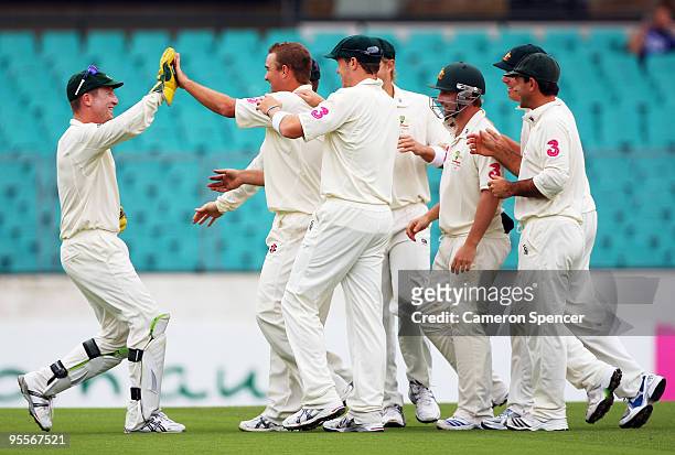 Nathan Hauritz of Australia celebrates with Brad Haddin after dismissing Imran Farhat of Pakistan during day two of the Second Test match between...