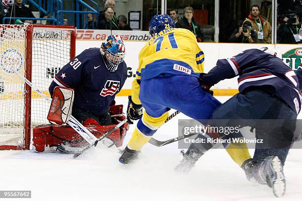 Mike Lee of Team USA stops the puck on a shot by Magnus Svensson Paajarvi of Team Sweden during the 2010 IIHF World Junior Championship Tournament...