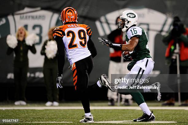 Wide receiver Brad Smith of the New York Jets scores a touchdown in the second quarter against Leon Hall of the Cincinnati Bengals at Giants Stadium...