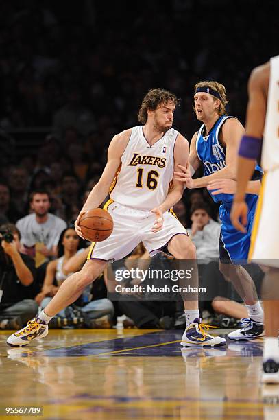 Pau Gasol of the Los Angeles Lakers posts up against Dirk Nowitzki of the Dallas Mavericks at Staples Center on January 3, 2010 in Los Angeles,...