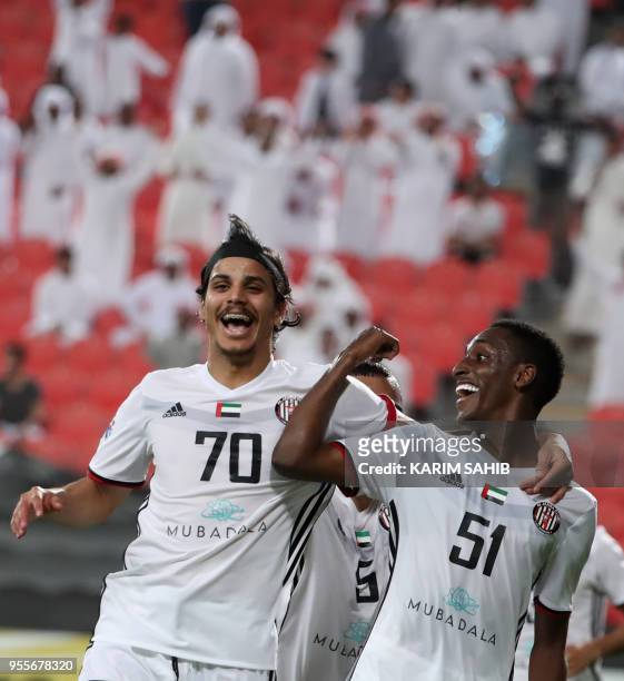 Al-Jazira club players Ahmed Al Hashmi and Khalifa Mubarak celebrate a goal during their AFC Champions League football match at the Mohammed Bin...