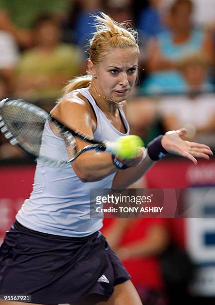 Sabine Lisicki of Germany hits a return against Elena Dementieva of Russia in their women's singles match on the third session of day three of the...