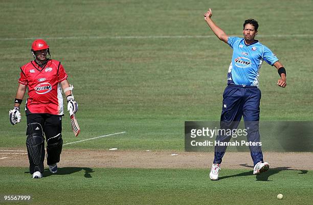 Craig McMillian of Canterbury walks off after being bowled out by Daryl Tuffey of Auckland during the HRV Cup Twenty20 match between the Auckland...