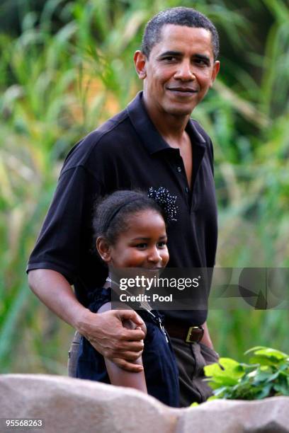 President Barack Obama and his youngest daughter Sasha walk through the Honolulu Zoo on Sunday, January 3, 2009 in Honolulu, Hawaii. Obama and his...