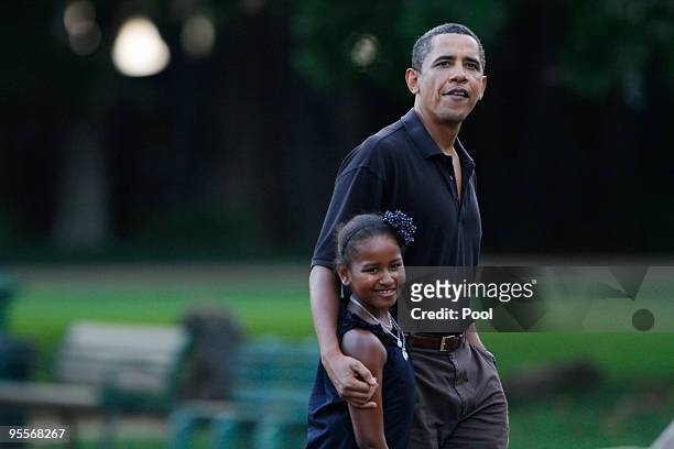 President Barack Obama and his youngest daughter Sasha walk through the Honolulu Zoo on Sunday, January 3, 2009 in Honolulu, Hawaii. Obama and his...