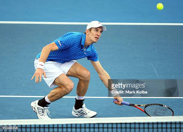 Jarkko Nieminen of Finland watches the ball as it pops up off the net in his first round match against Richard Gasquet of France during day two of...