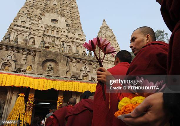Buddhist monks gather to attend the Dalai Lama's visit to the historical Mahabodhi Temple, where Lord Buddha attained enlightenment, in Bodhgaya in...
