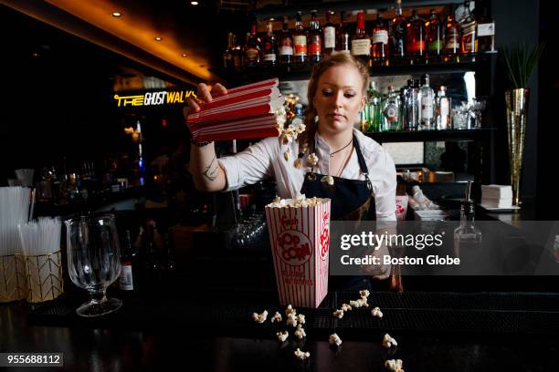 Bartender Borbala Anger prepares a Box Office, a drink with Bulleit bourbon, butterscotch, px sherry, blood orange, lemon served in a box of popcorn,...