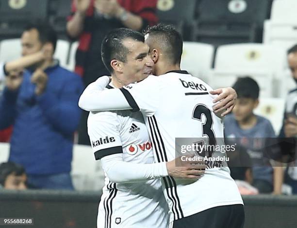 Adriano Correia of Besiktas celebrates with his teammate Gary Medel after scoring a goal during a Turkish Super Lig soccer match between Besiktas and...
