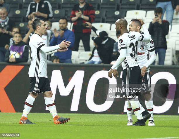 Adriano Correia of Besiktas celebrates with his teammates Gary Medel and Vagner Love after scoring a goal during a Turkish Super Lig soccer match...