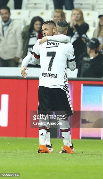 Adriano Correia of Besiktas celebrates with his teammate Ricardo Quaresma after scoring a goal during a Turkish Super Lig soccer match between...