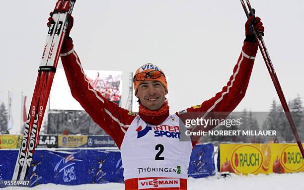 S Johnny Spillane celebrates after competing in the FIS Nordic Combined World Cup in the eastern German town of Oberhof on January 3, 2010. USA's...