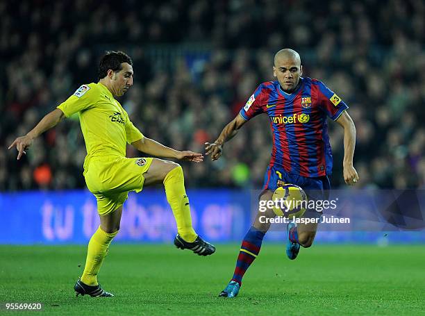 Daniel Alves of FC Barcelona duels for the ball with Santi Cazorla of Villarreal during the La Liga match between Barcelona and Villarreal at the...