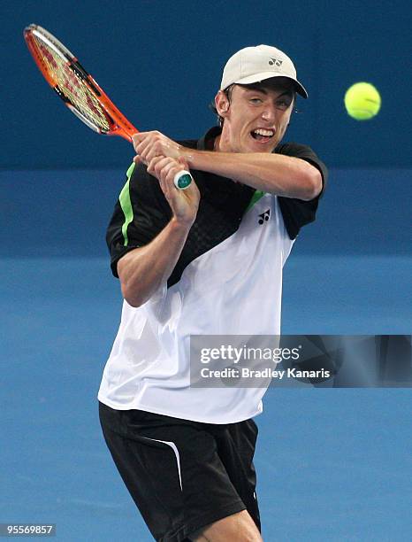 John Millman of Australia plays a backhand in his first round match against Radek Stepanek of Czechoslovakia during day two of the Brisbane...