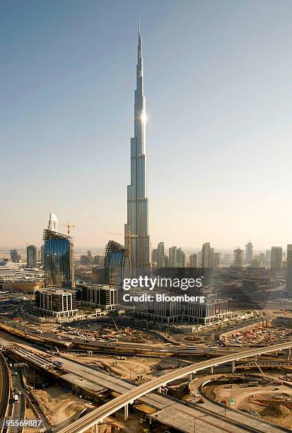 The Burj Dubai, the world's tallest building, towers over the skyline in Dubai, United Arab Emirates, on Sunday, Jan. 3, 2010. Dubai's Sheikh...