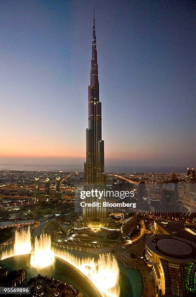 The Burj Dubai, the world's tallest building, illuminated at night towers over the skyline in Dubai, United Arab Emirates, on Sunday, Jan. 3, 2010....