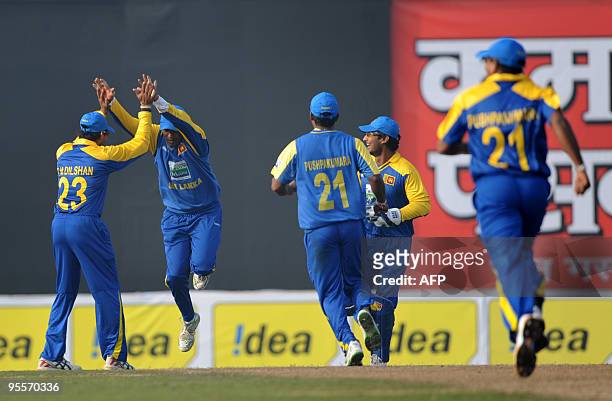 Sri Lankan cricketers celebrate after the dismissal of Bangladeshi cricketer Raqibul Hasan during the Tri-Nation Tournament at The Sher-e Bangla...