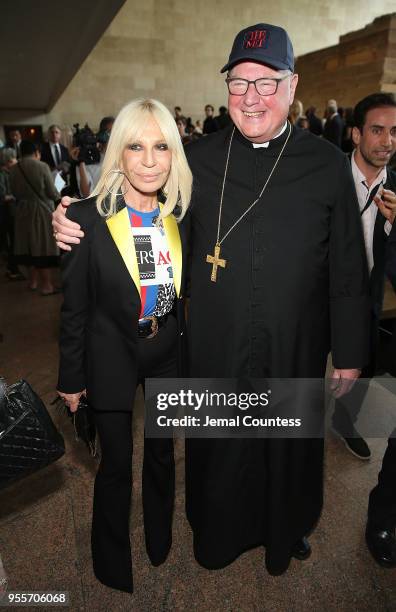 Designer Donatella Versace and Cardinal Timothy Michael Dolan attend the Heavenly Bodies: Fashion & The Catholic Imagination Costume Institute Gala...
