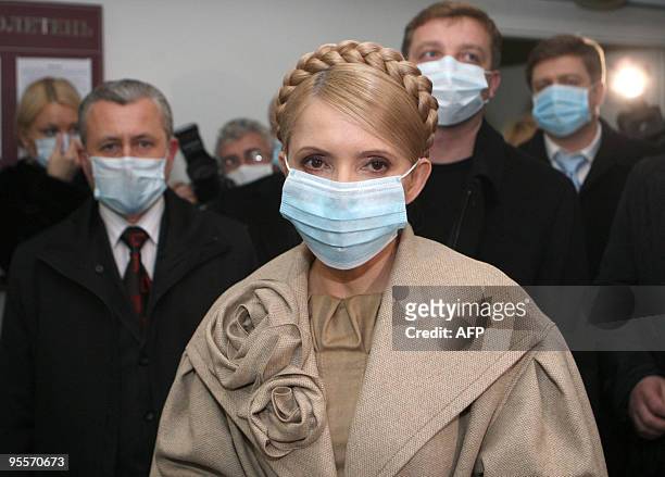 Ukraine's Prime Minister Yulia Tymoshenko wears a protective mask as she visits a hospital in Ivano-Frankivsk on November 3, 2009. The World Health...