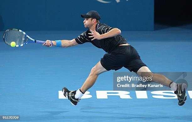 Andy Roddick of the USA stretches out to play a forehand in his first round match against Peter Luczak of Australia during day two of the Brisbane...