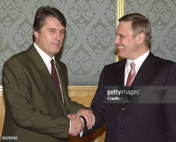 Russian Prime Minister Mikhail Kasyanov , and his Ukrainian counterpart Viktor Yushchenko, left, shake hands during their meeting in Moscow, 10 April...