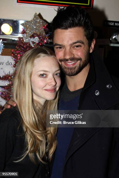 Amanda Seyfried and boyfriend Dominic Cooper pose backstage at the hit rock musical "Rock of Ages" on Broadway at The Brooks Atkinson Theater on...
