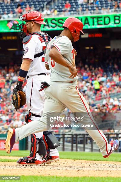 Philadelphia Phillies right fielder Nick Williams scores in the eighth inning as Washington Nationals catcher Matt Wieters waits for the late throw...