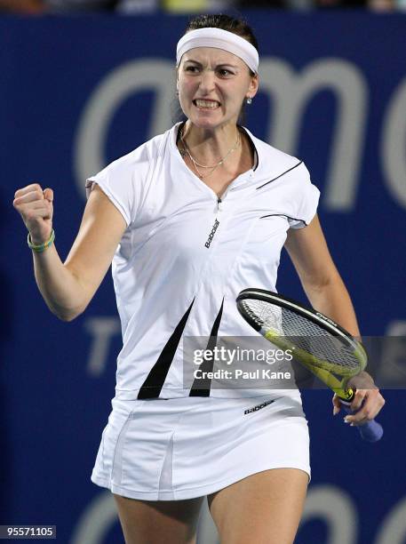 Yaroslava Shvedova of Kazakhstan celebrates winning her match against Laura Robson of Great Britain in the Group B match between Great Britain and...