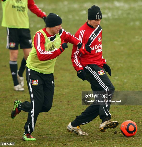 Patrick Helmes and Stefan Kiessling battle for the ball during the trainings session of Bayer Leverkusen at the training ground on January 4, 2010 in...