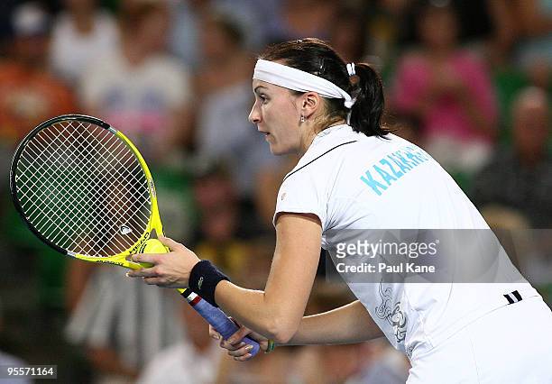 Yaroslava Shvedova of Kazakhstan prepares to serve in her match against Laura Robson of Great Britain in the Group B match between Great Britain and...