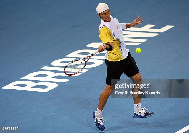 Peter Luczak of Australia plays a forehand in his first round match against Andy Roddick of the USA during day two of the Brisbane International 2010...