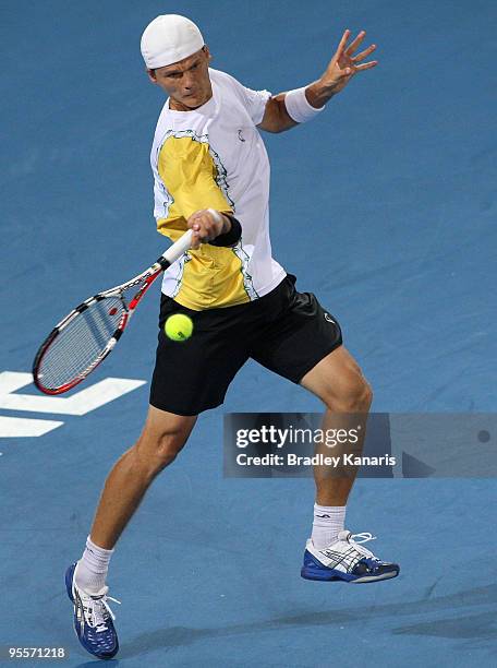 Peter Luczak of Australia plays a forehand in his first round match against Andy Roddick of the USA during day two of the Brisbane International 2010...