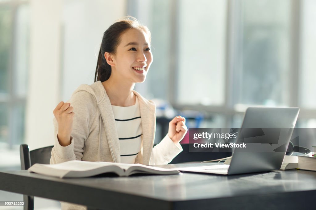 Single College Student Using Computer Young College Students Use Computers In The Classroom High-Res Stock ...