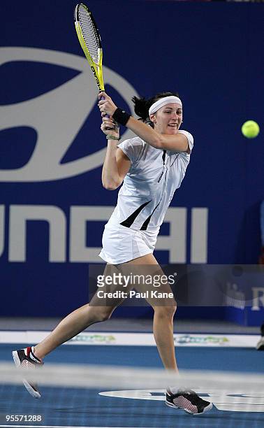 Yaroslava Shvedova of Kazakhstan plays a backhand shot in her match against Laura Robson of Great Britain in the Group B match between Great Britain...