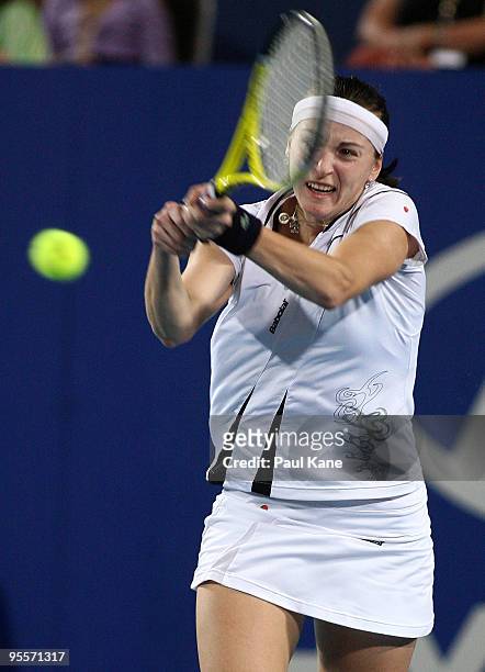 Yaroslava Shvedova of Kazakhstan plays a backhand shot in her match against Laura Robson of Great Britain in the Group B match between Great Britain...