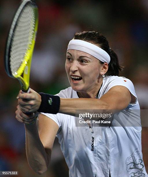 Yaroslava Shvedova of Kazakhstan plays a backhand shot in her match against Laura Robson of Great Britain in the Group B match between Great Britain...